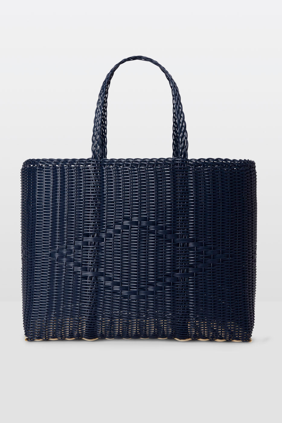 Navy woven handbag on a light gray background