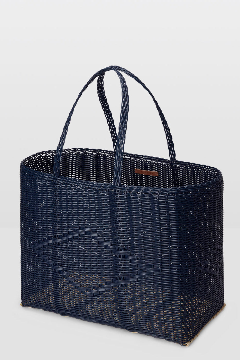 Navy woven tote bag on a light gray background