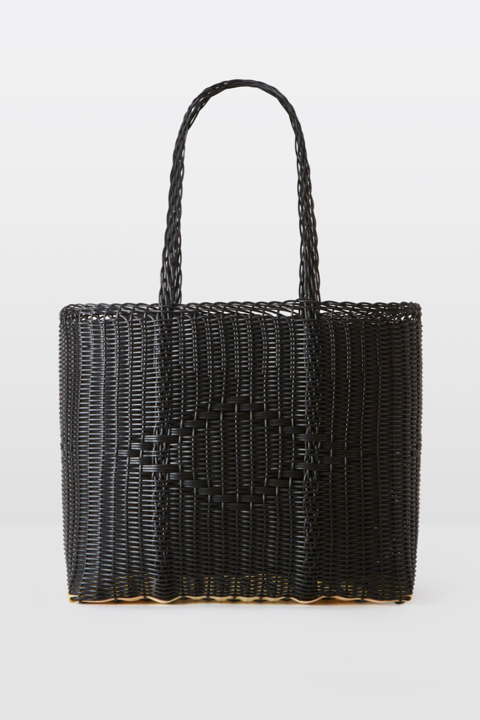Black woven basket with handles on a white background