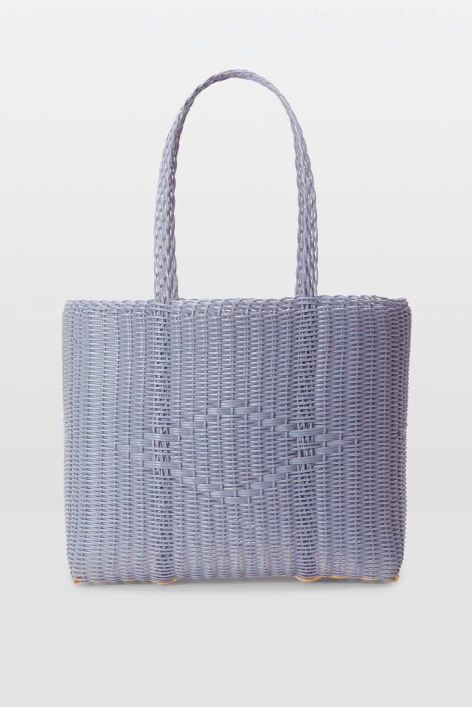 Woven handbag on a light gray background