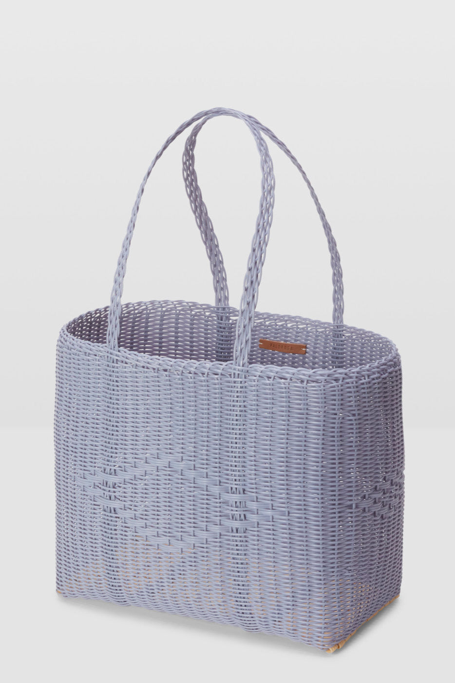 Woven handbag on a light gray background