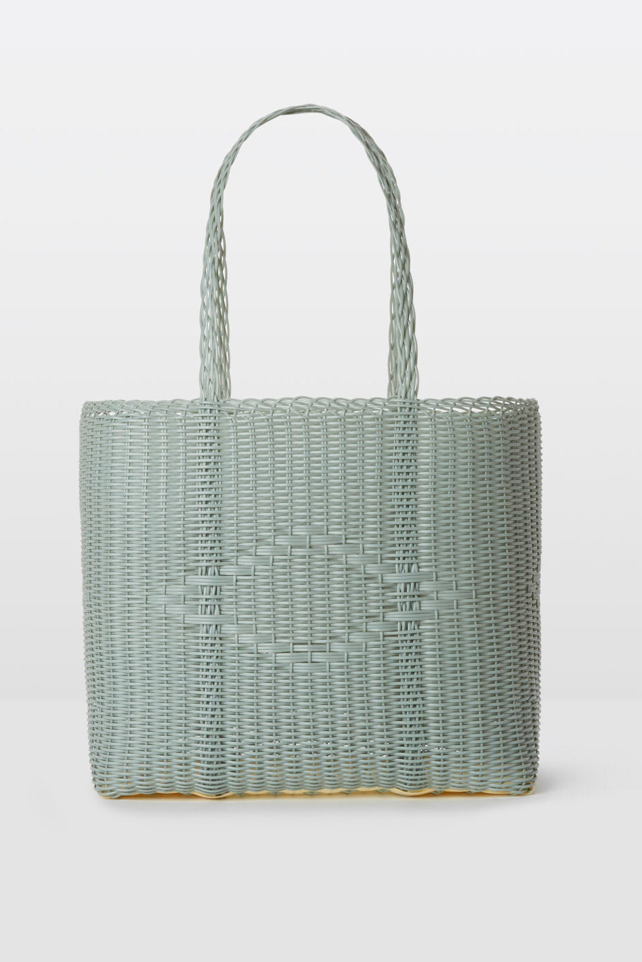 Woven handbag on a light gray background
