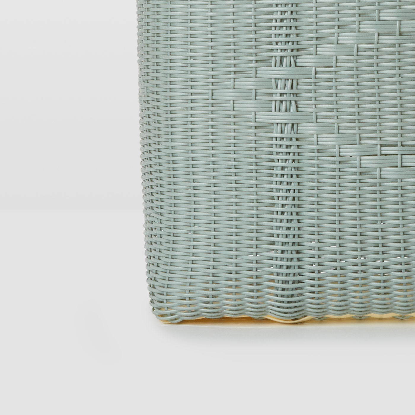 Base of a woven bag on a white background