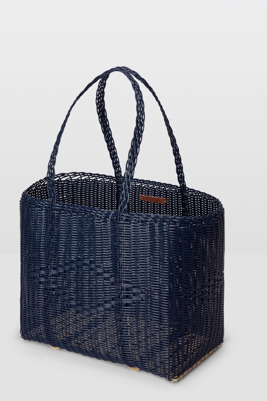 Black woven handbag on a light gray background