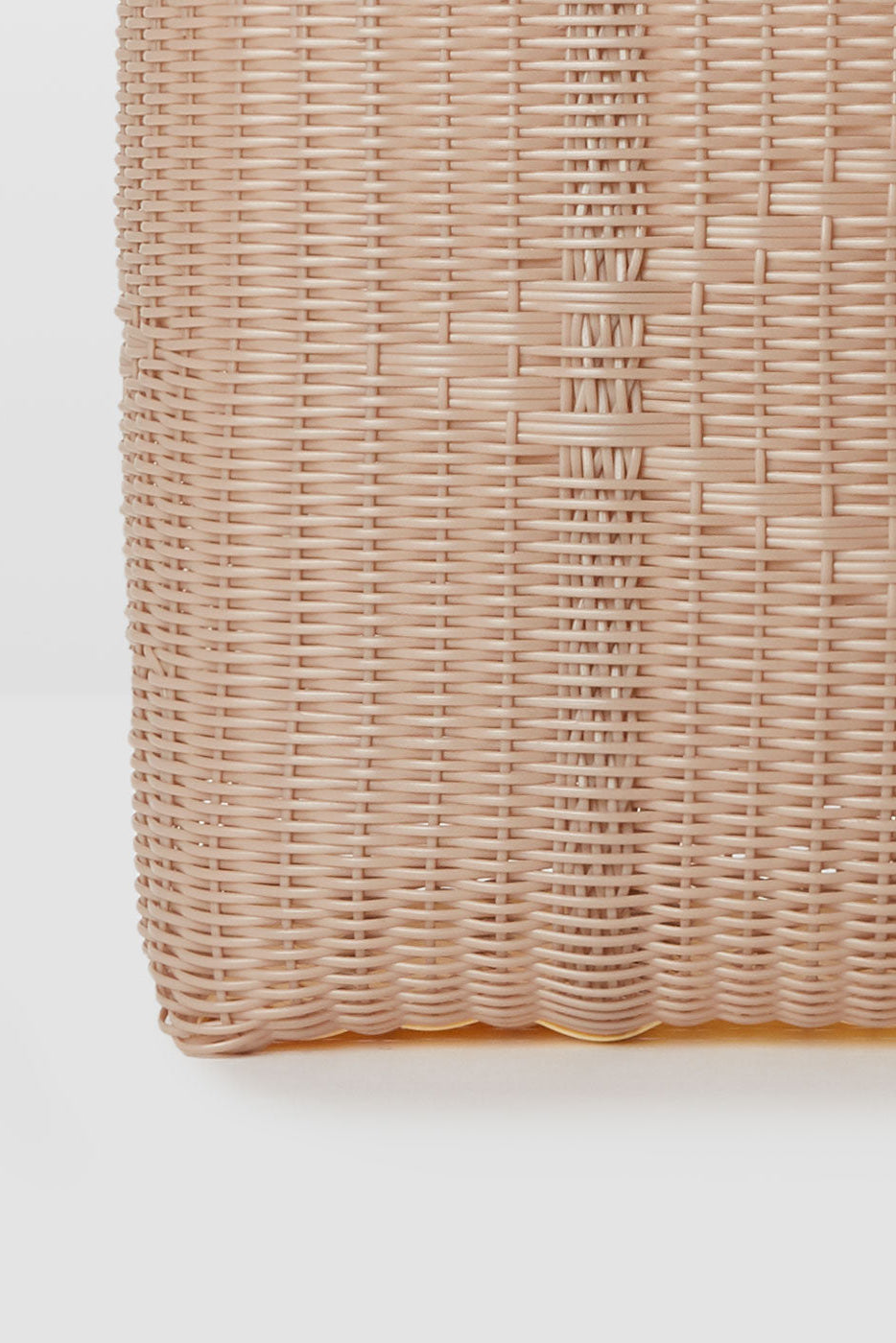 Close up detail of handwoven recycled plastic weave on Palorosa Powder bag