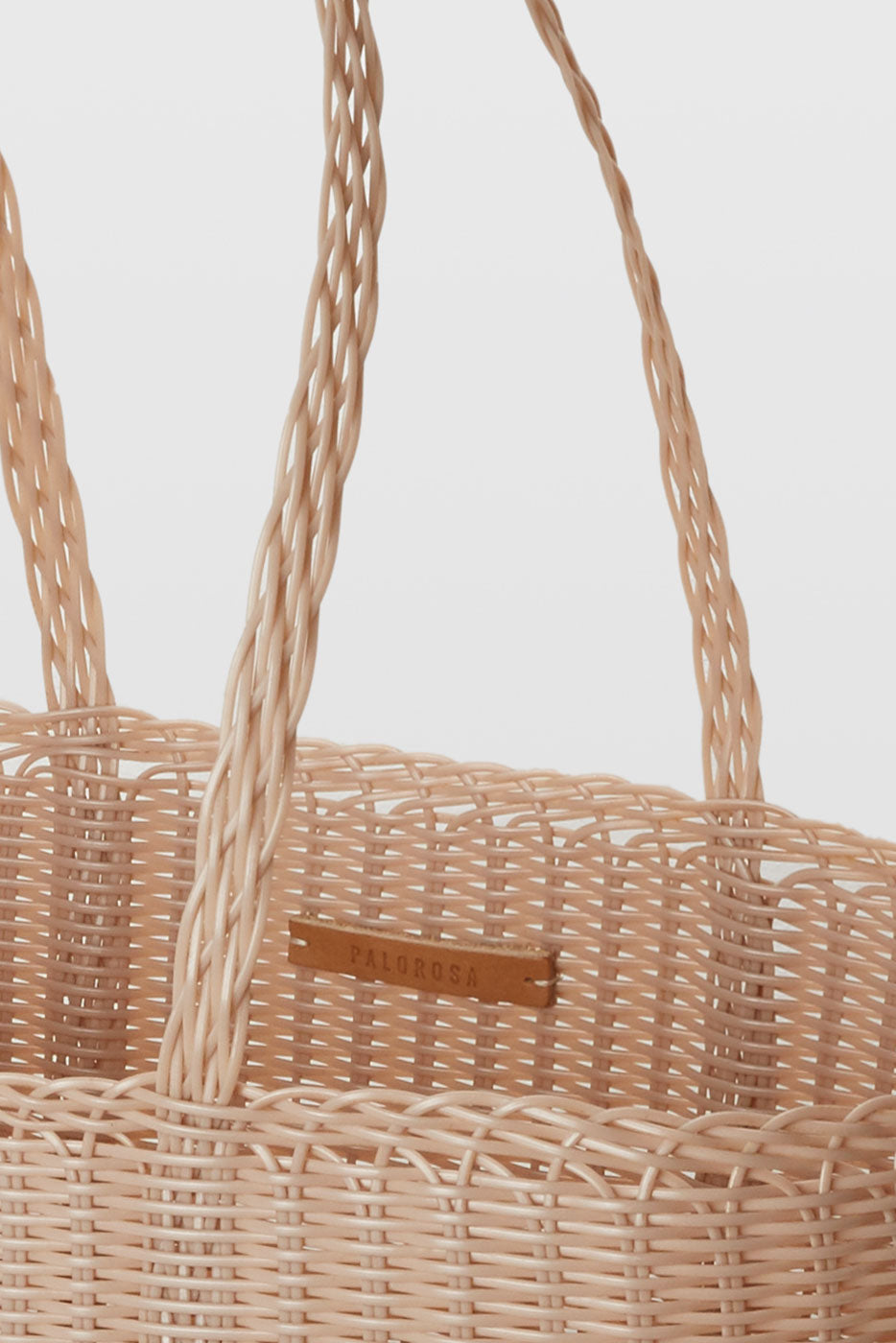 Close up detail of handwoven recycled plastic weave on Palorosa Powder bag