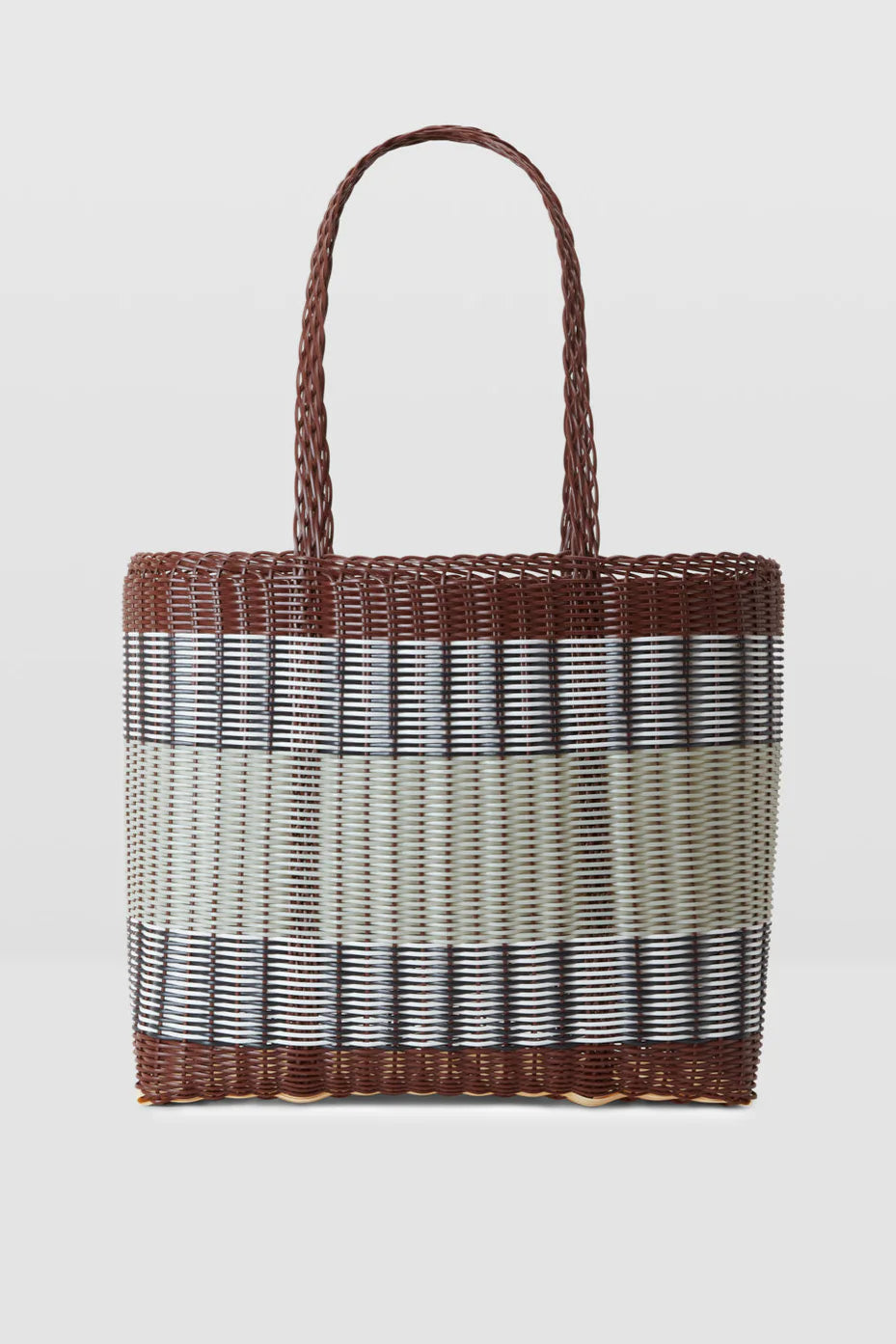 Woven basket with a gradient pattern on a light gray background
