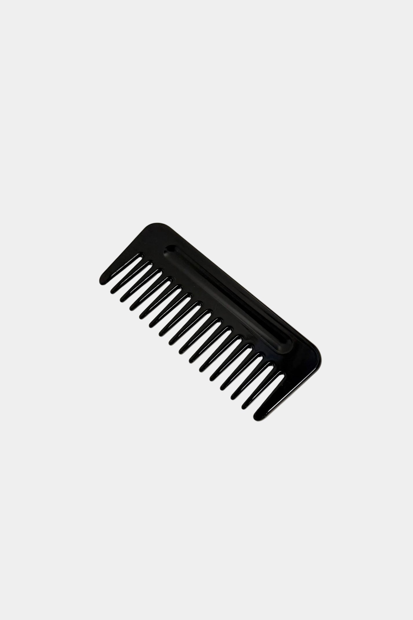 Black comb on a white background