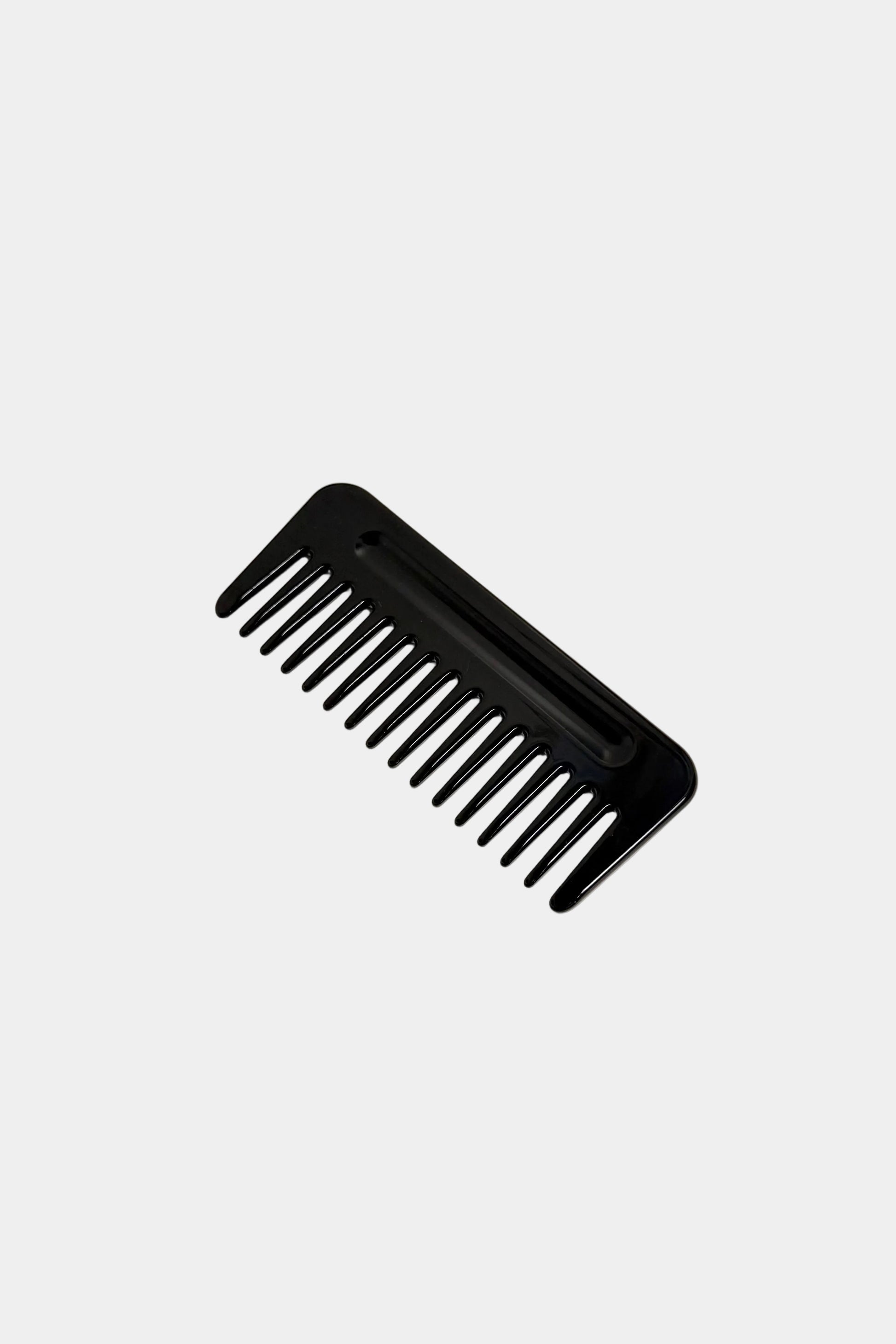Black comb on a white background