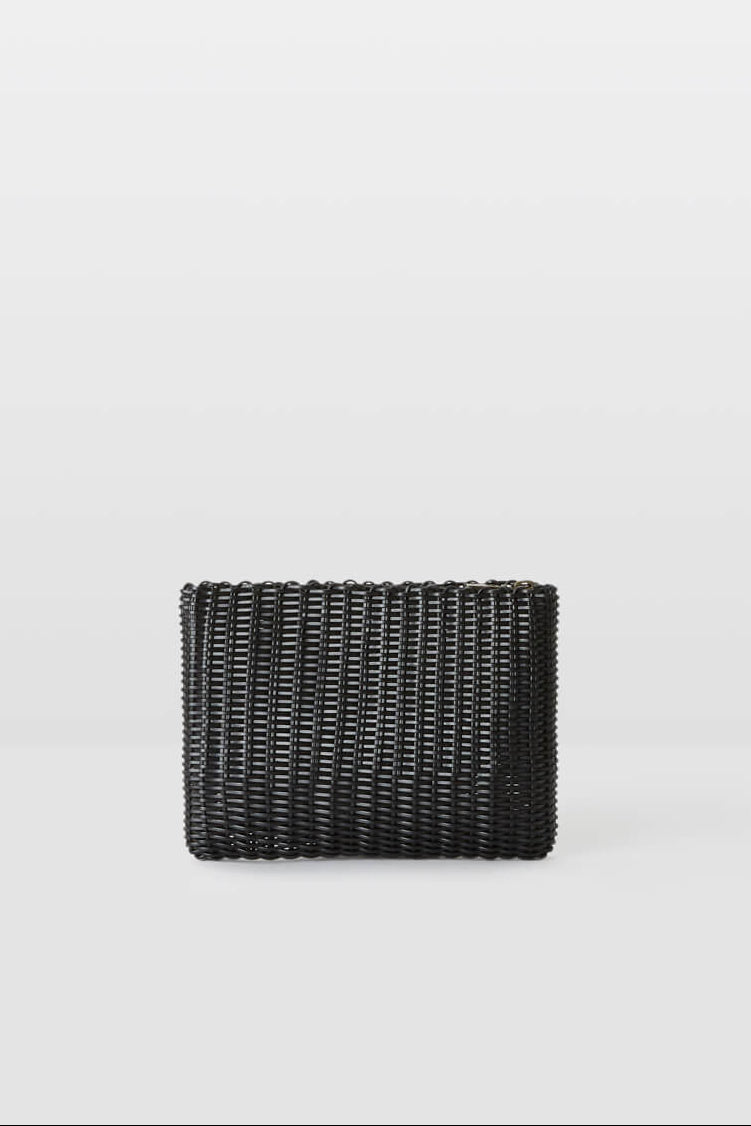 Black woven clutch on a light gray background