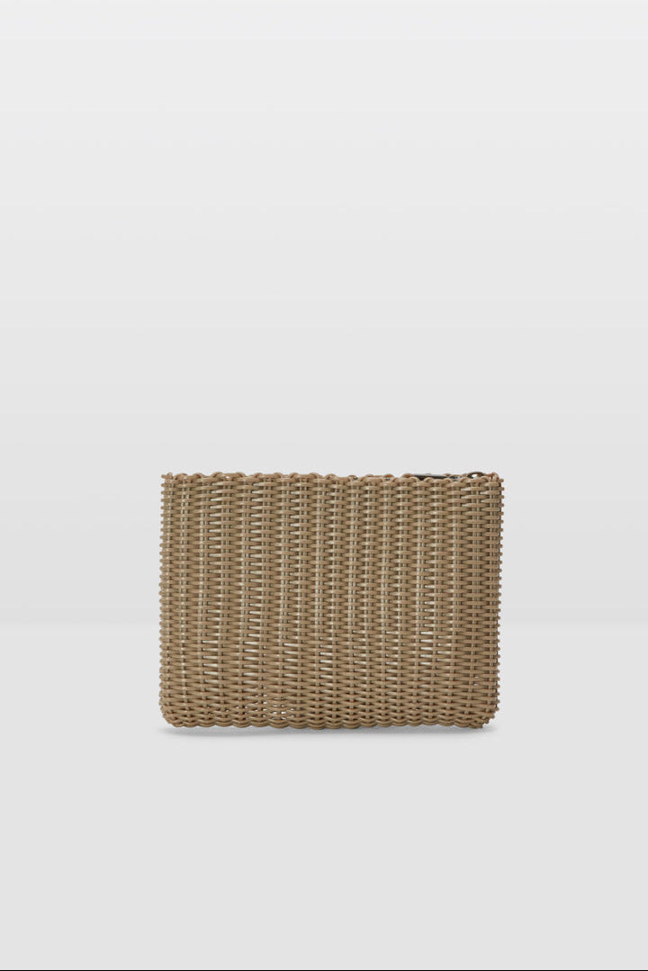 Woven clutch bag on a light gray background
