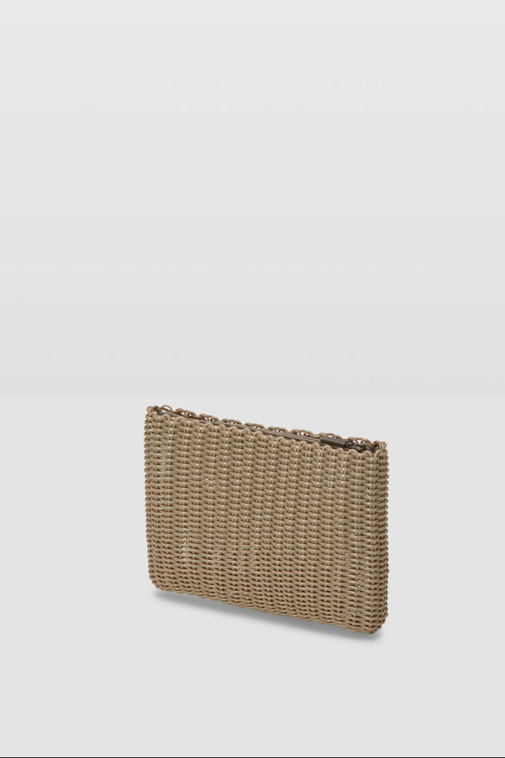 Woven clutch bag on a light gray background