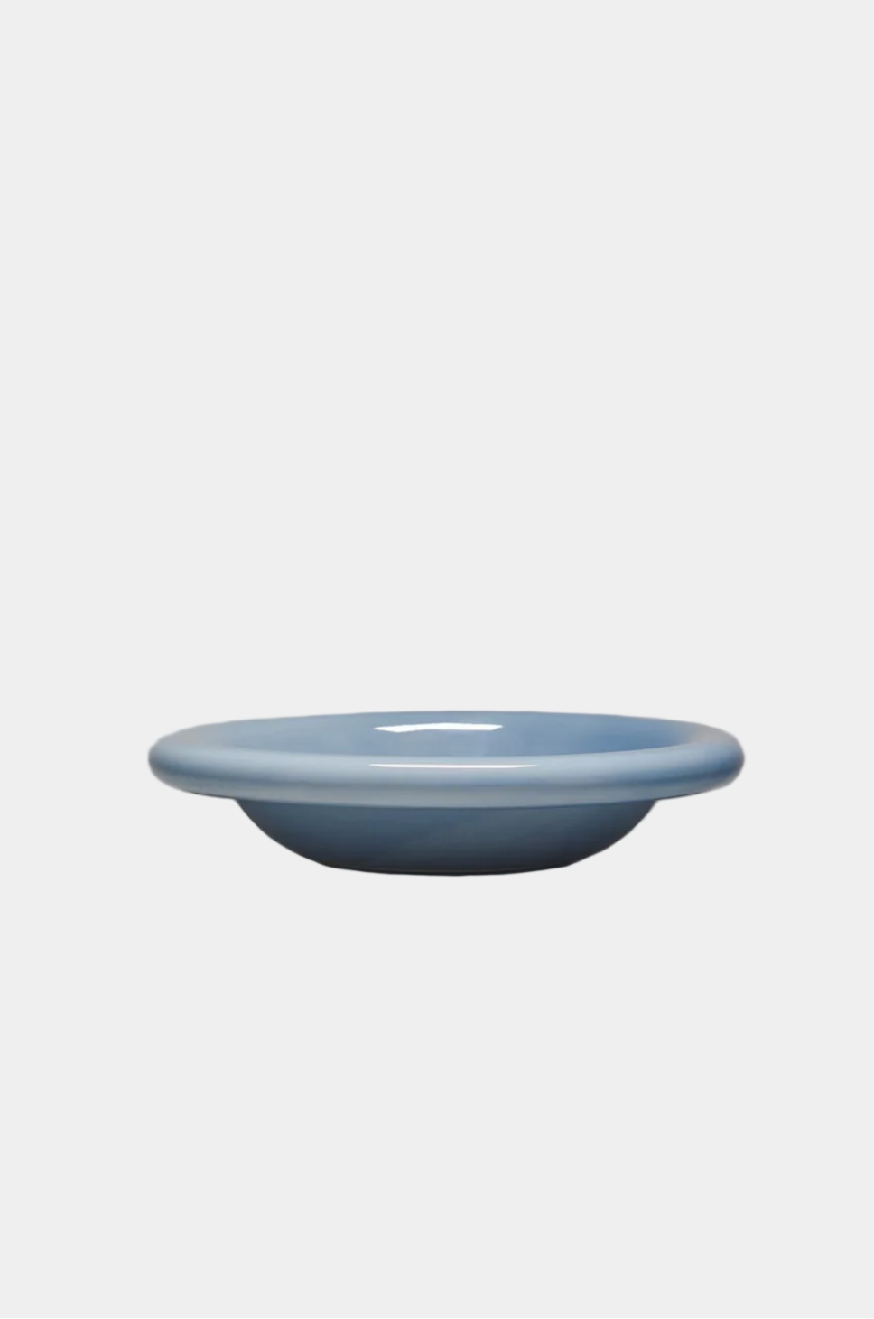 Blue ceramic dish on a gray background