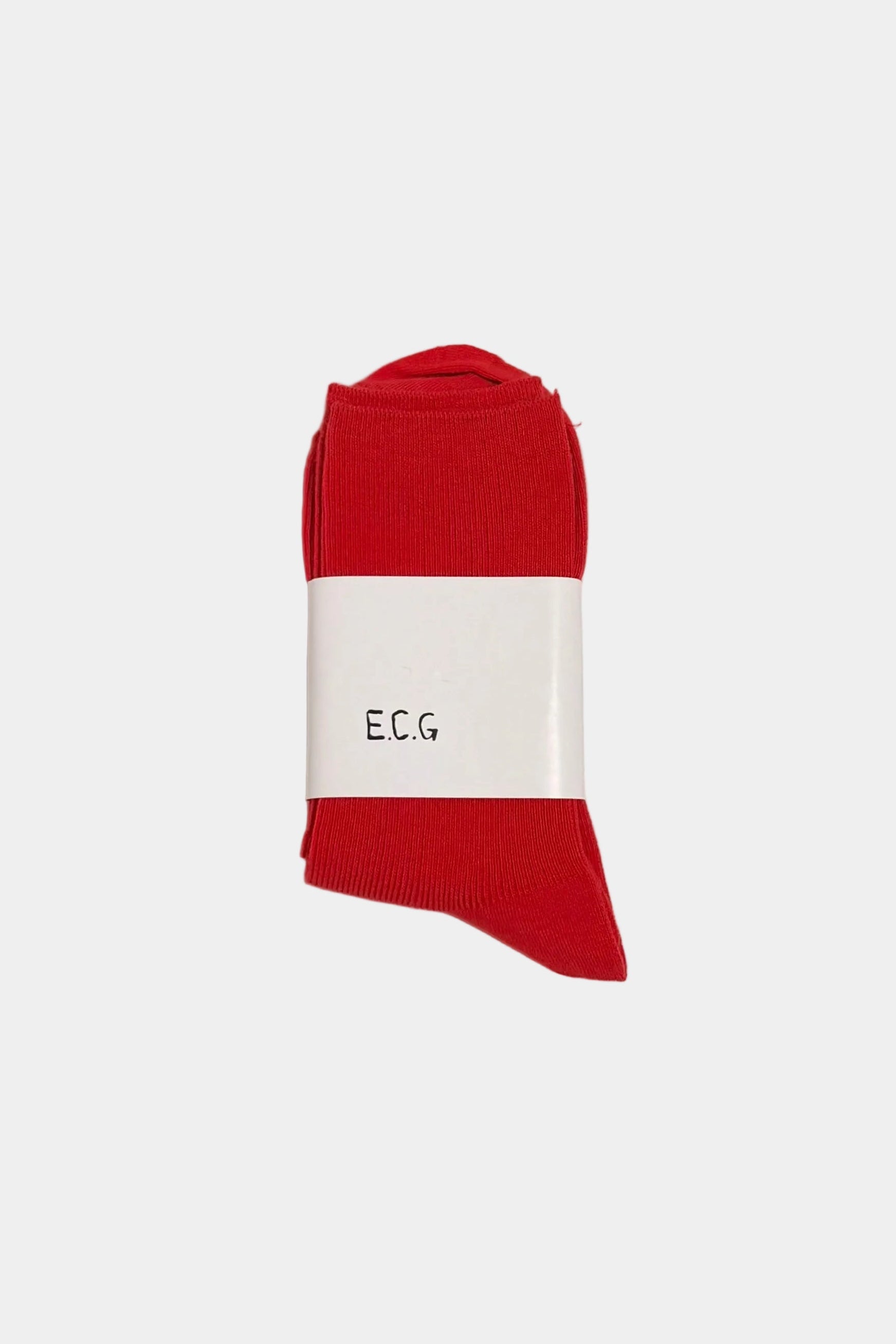 Red sock with a white label on a light grey background
