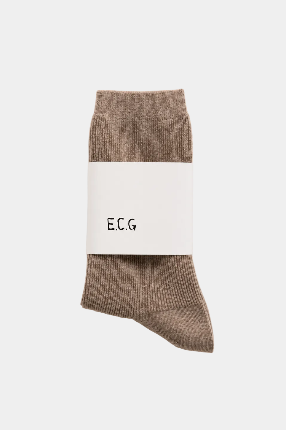 A pair of cotton taupe-brown crew socks wrapped in a white paper band with the brand name 'E.C.G’