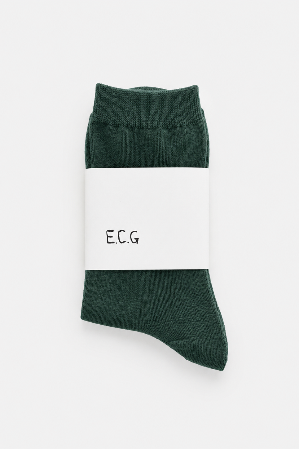 Green sock with a white label displaying 'E.C.G.' on a white background