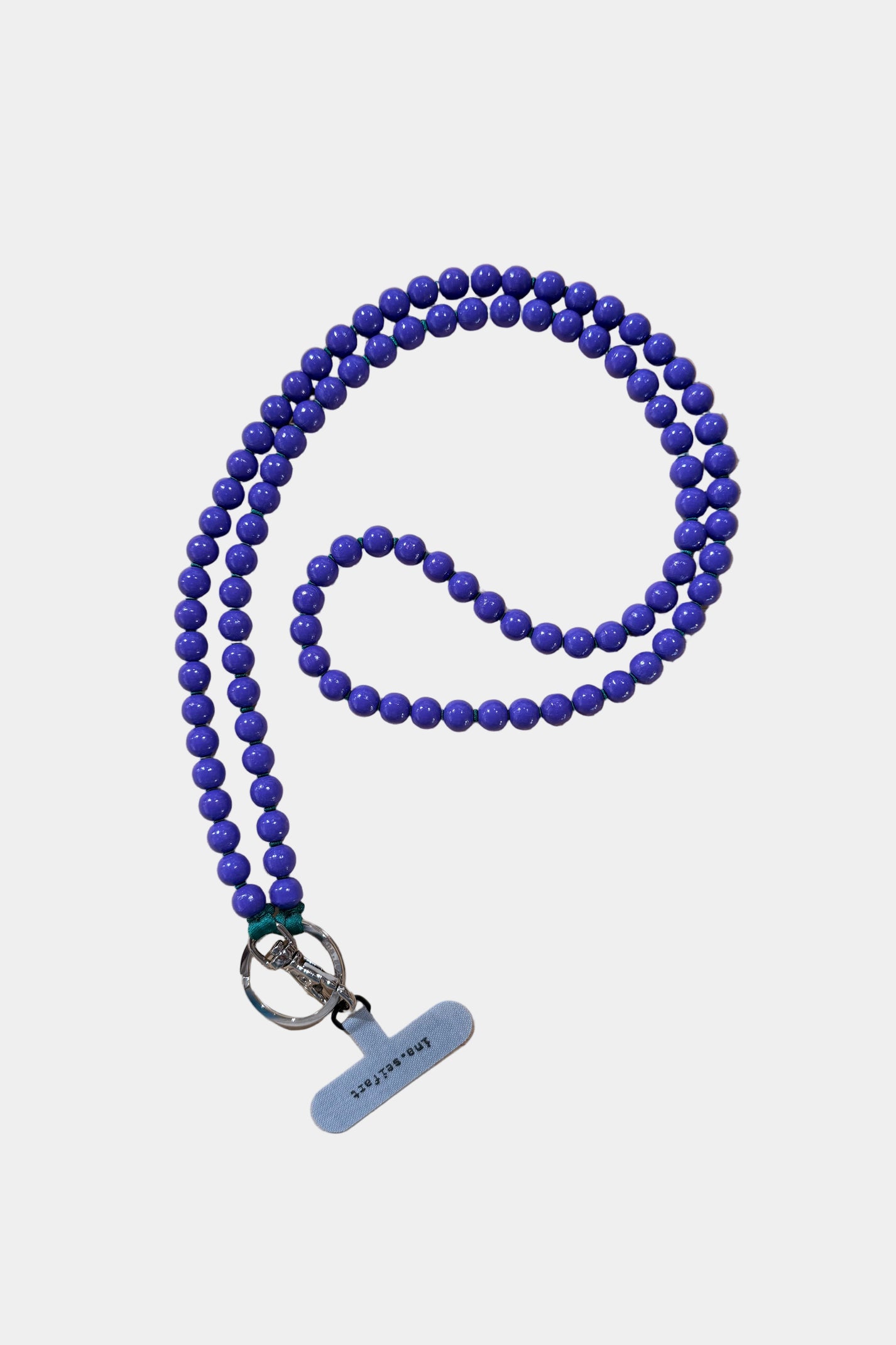 Blue beaded phone necklace with a silver clasp on a white background