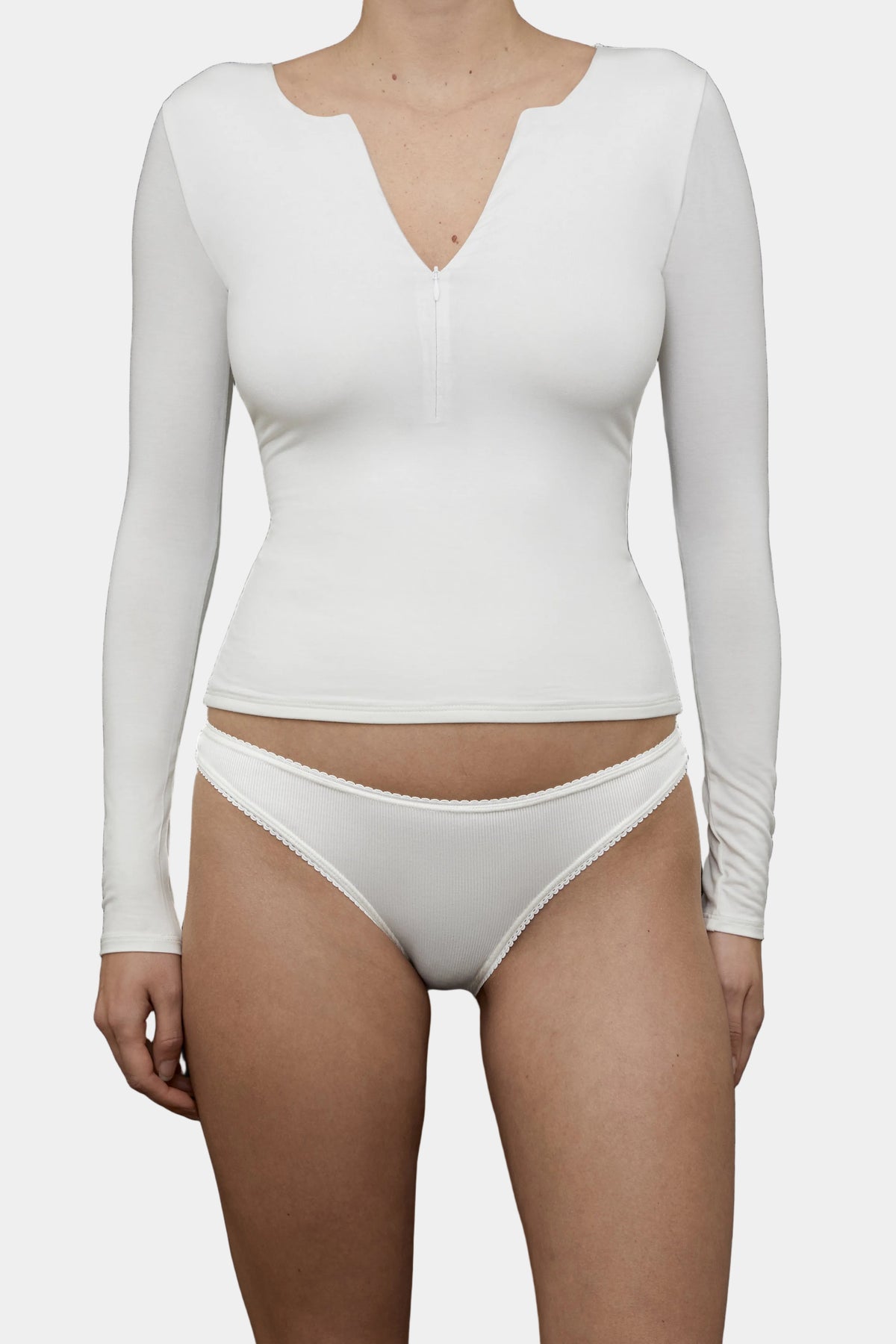  women wearing the Kye Intimates Half zip in Natural viewed from the front - East Coast General