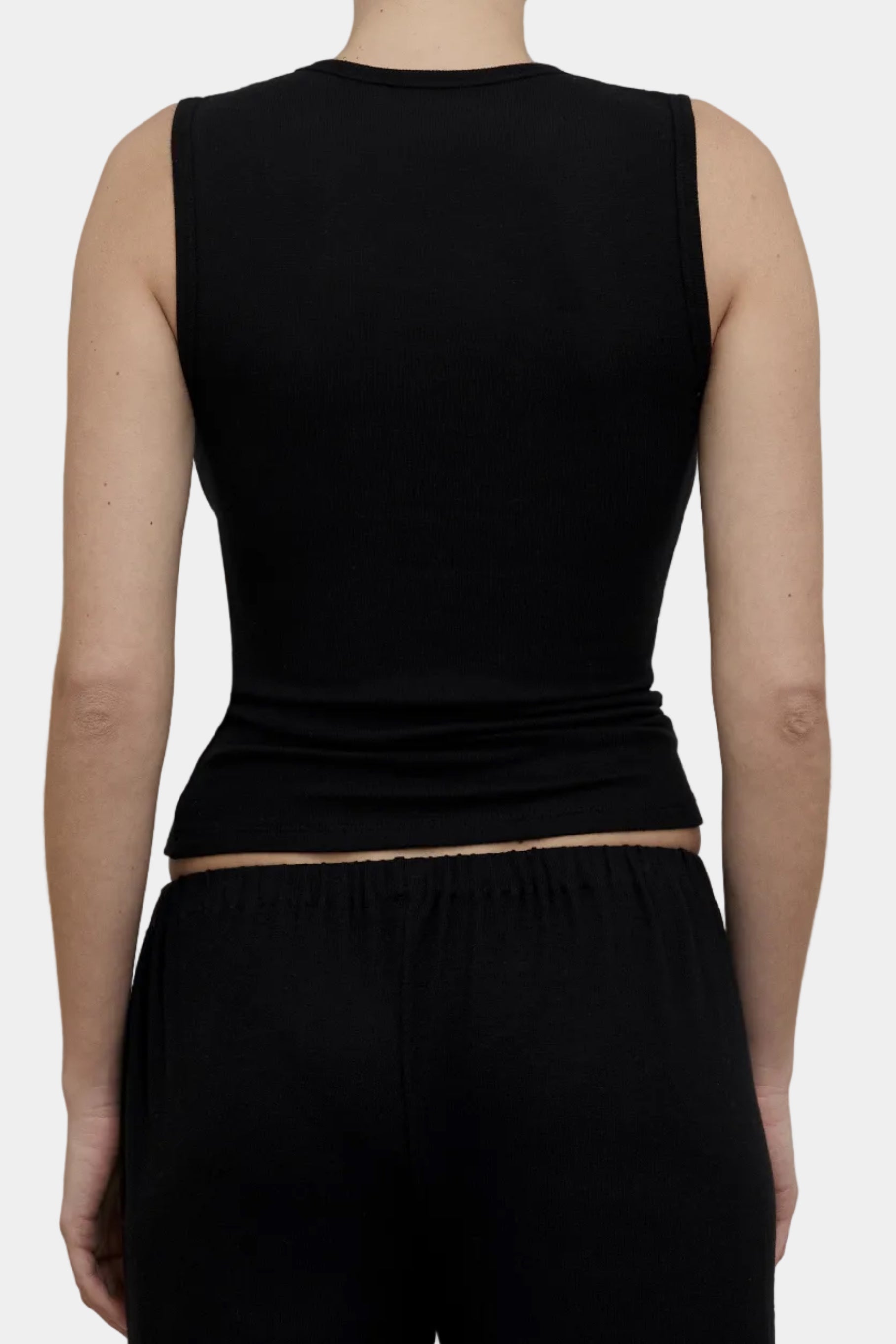Back view of KYE Intimates Black Vest showing high crew neck back construction