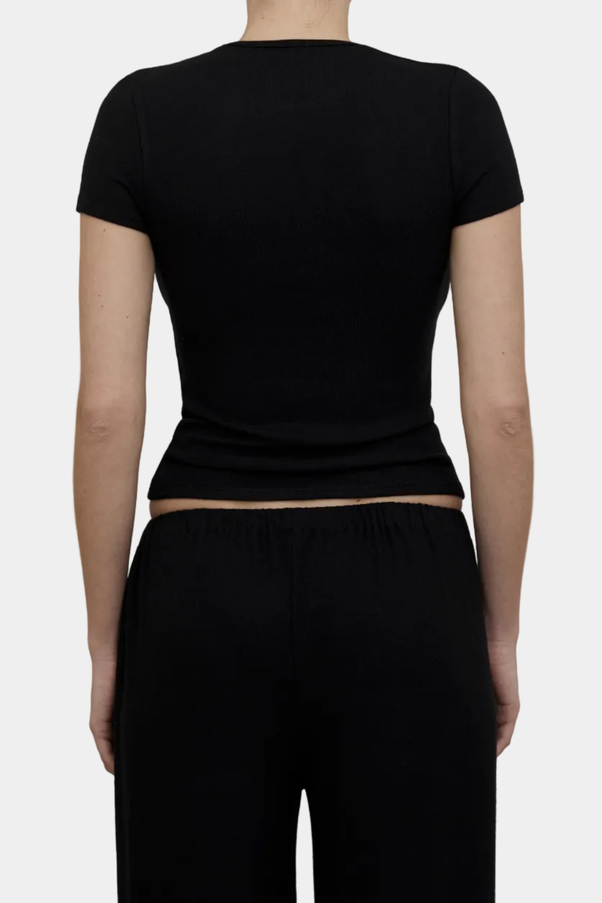 Back view of KYE Intimates Black Hacci Baby Tee showing crew neck construction and sleeve cut