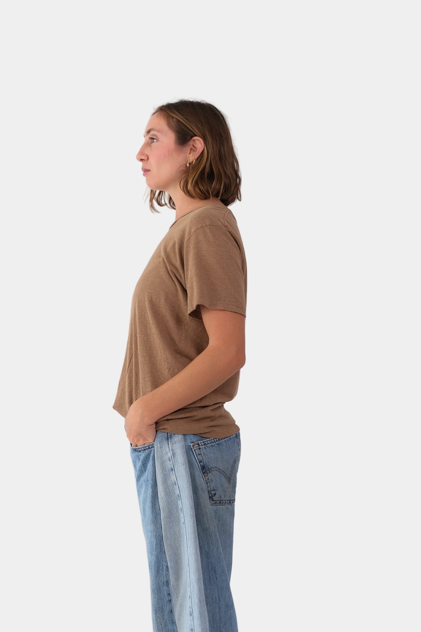a person wearing the jungmaven LOREL TEE in Coyote on a plain background