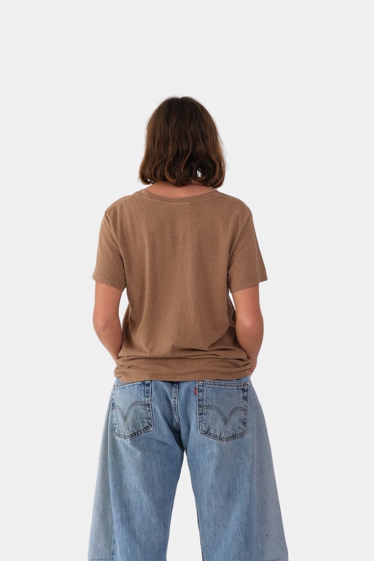 a person wearing the jungmaven LOREL TEE in Coyote on a plain background