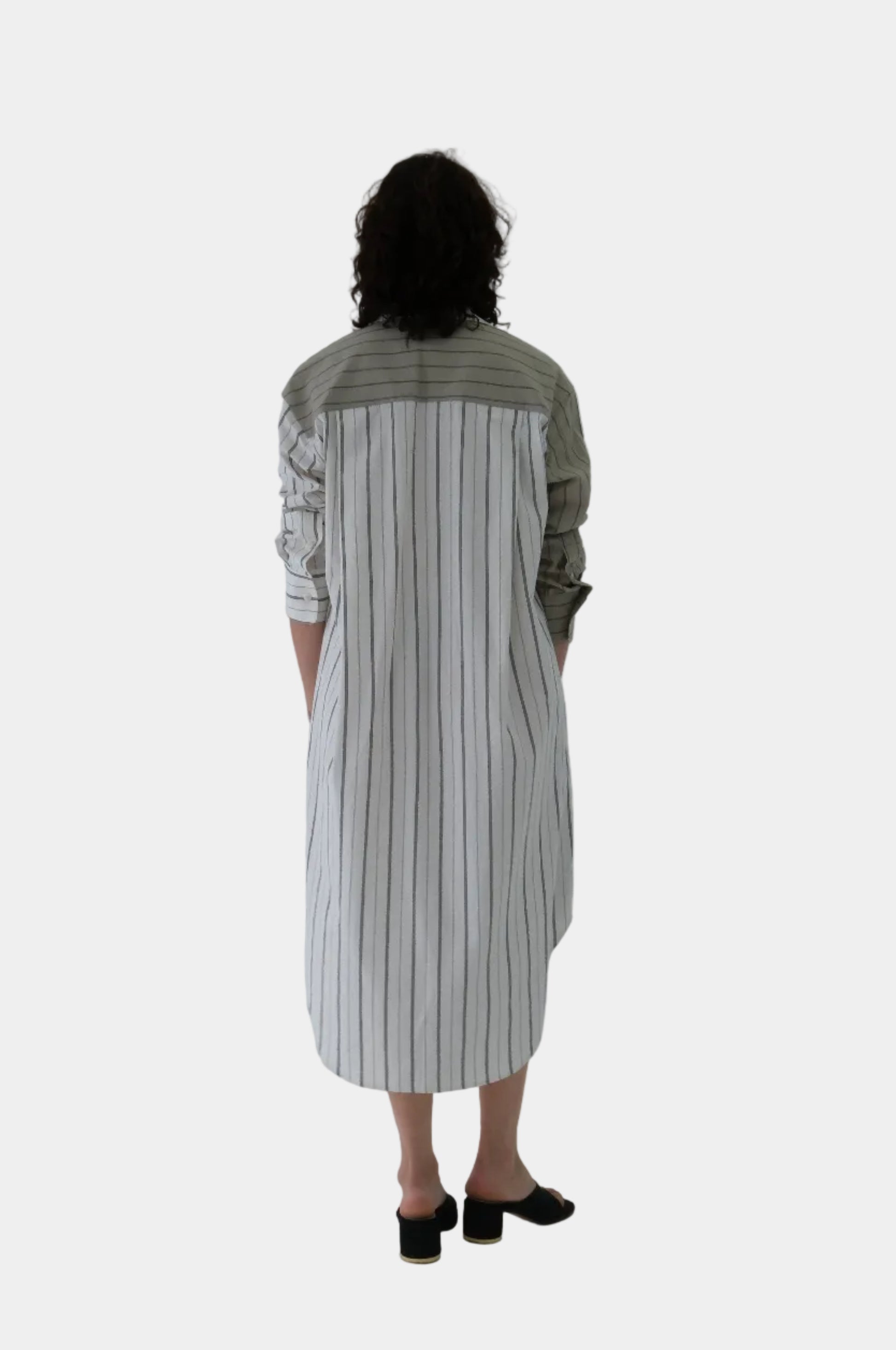 Person wearing a striped dress  on a white background