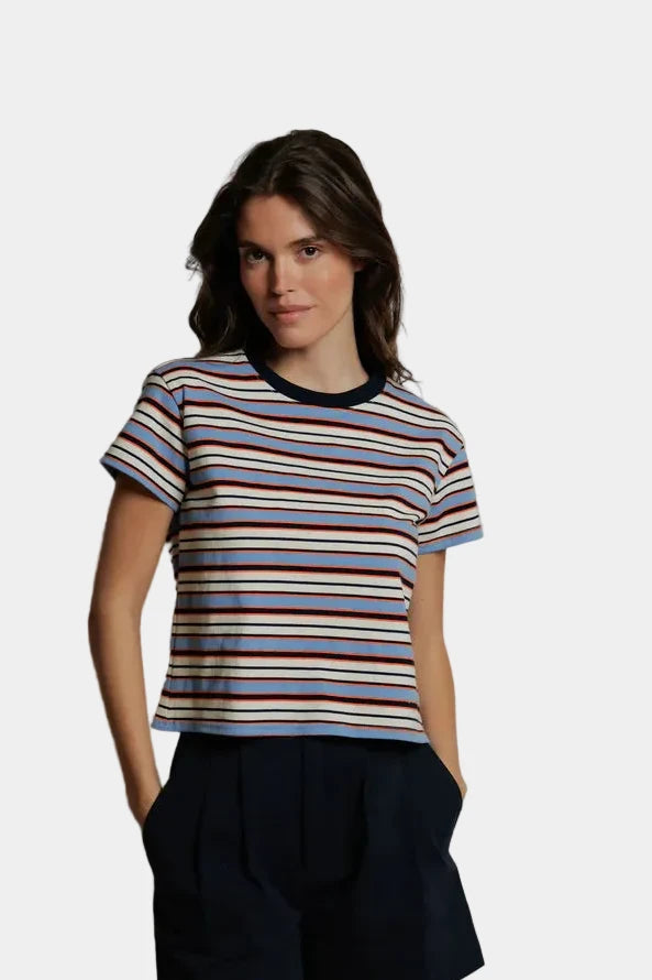 A person wearing the Dawn tee in pacific clementine stripe, viewed from the front  - east coast general
