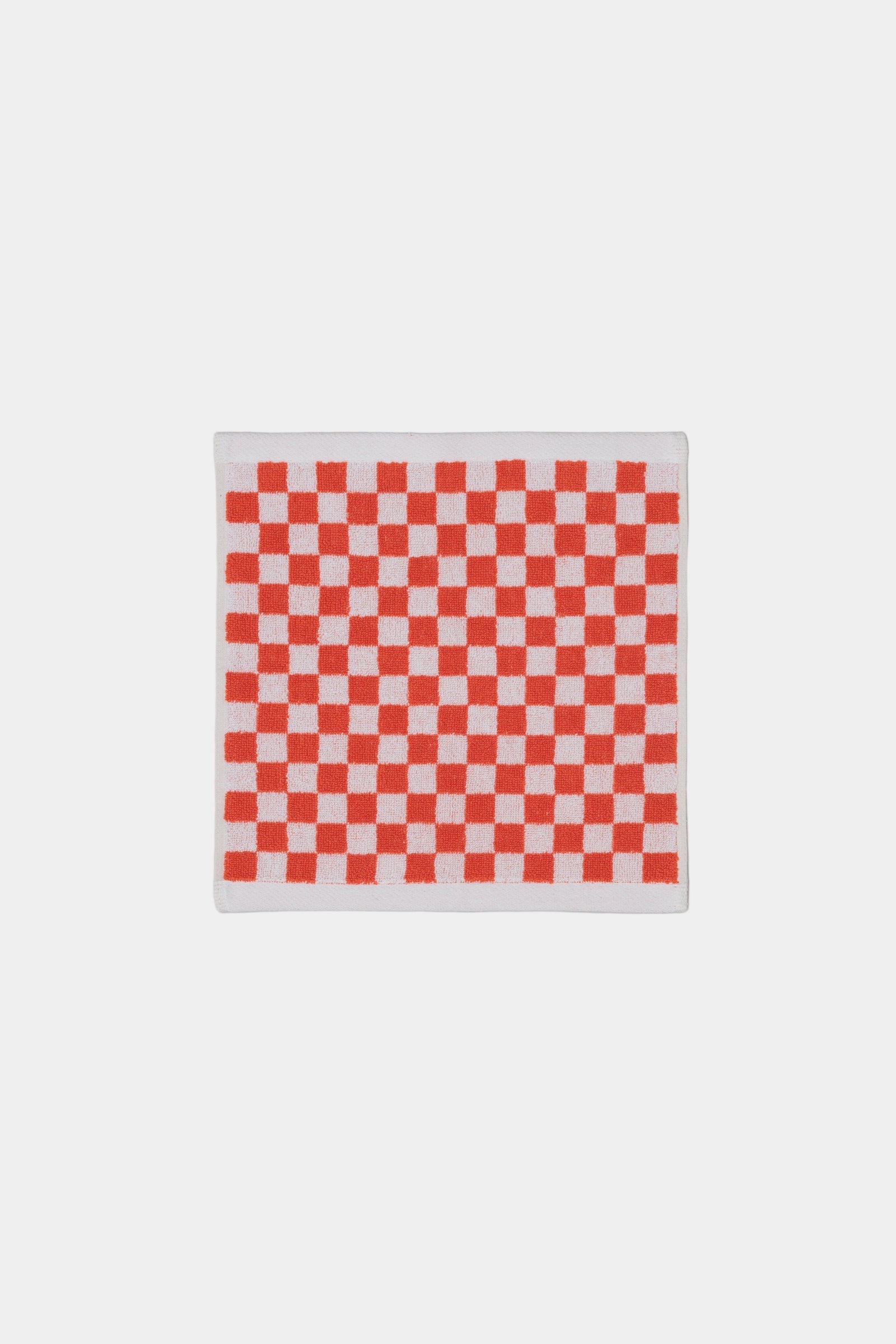 Red and white checkered paper on a gray background
