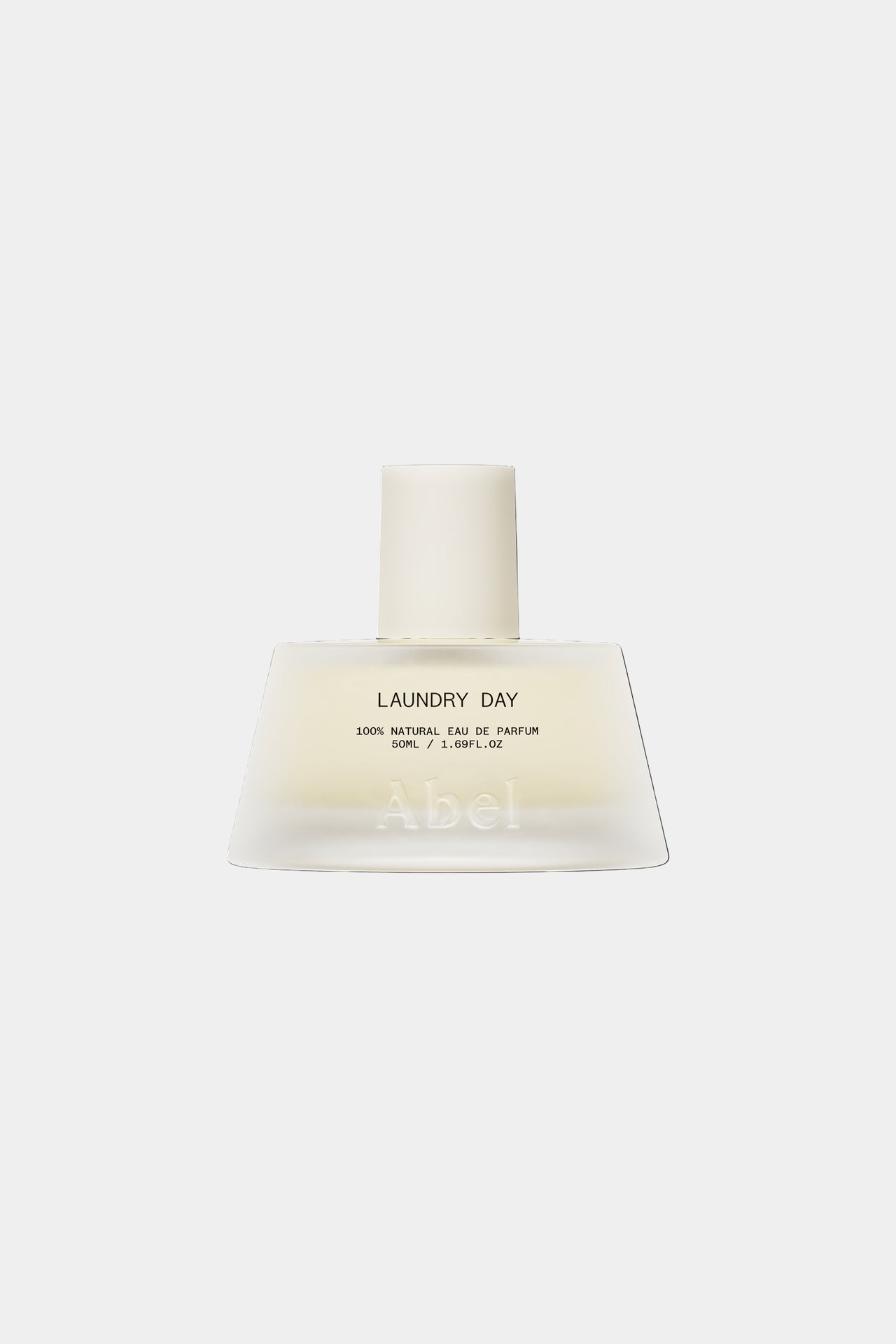 Perfume bottle labeled 'Laundry Day' on a white background
