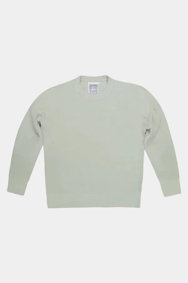 Light green sweater on a white background