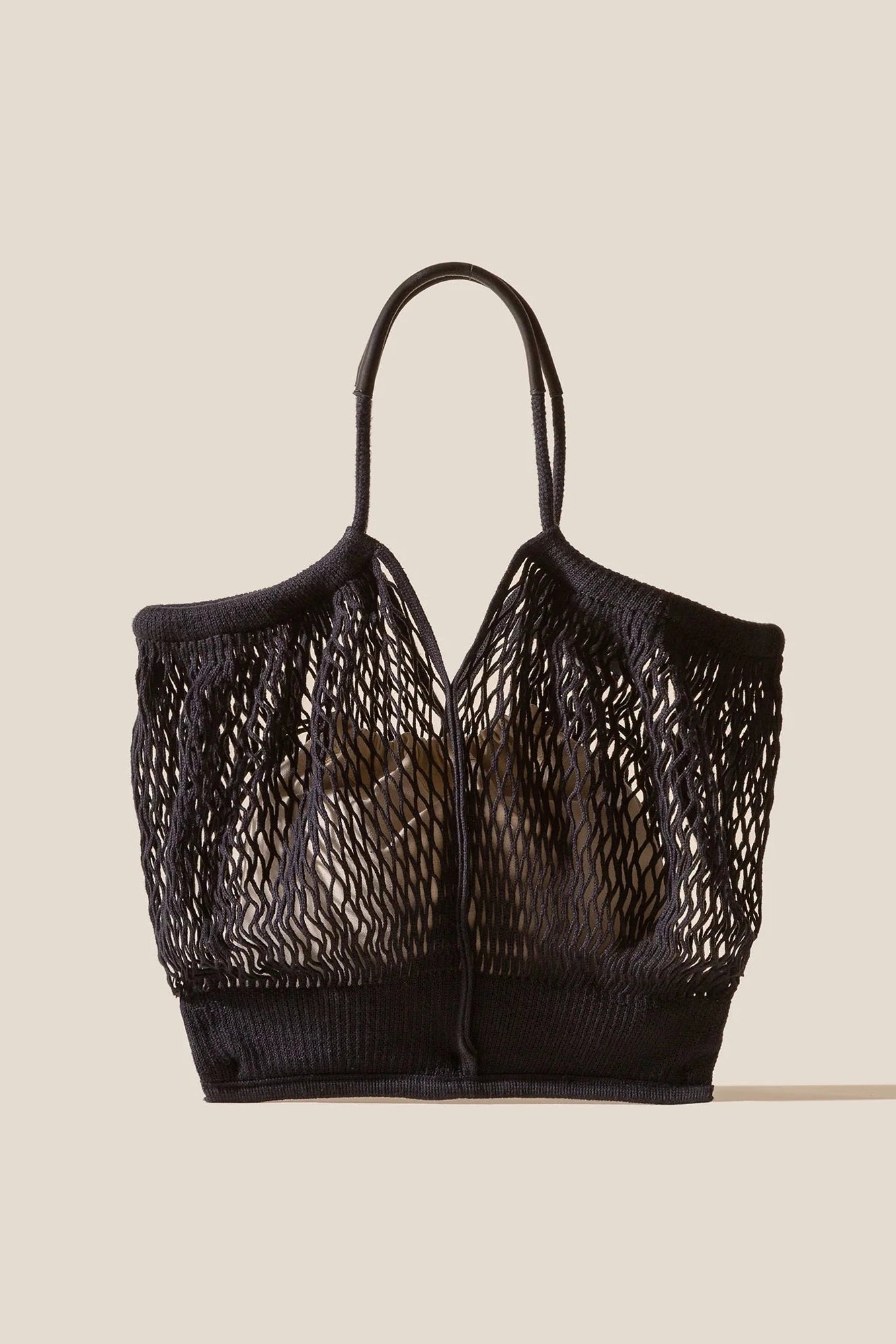 Black Crochet bag on a beige background