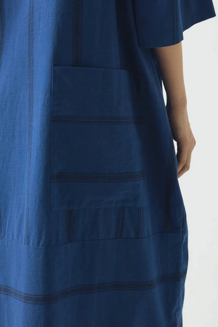 Blue dress with a pocket on a white background