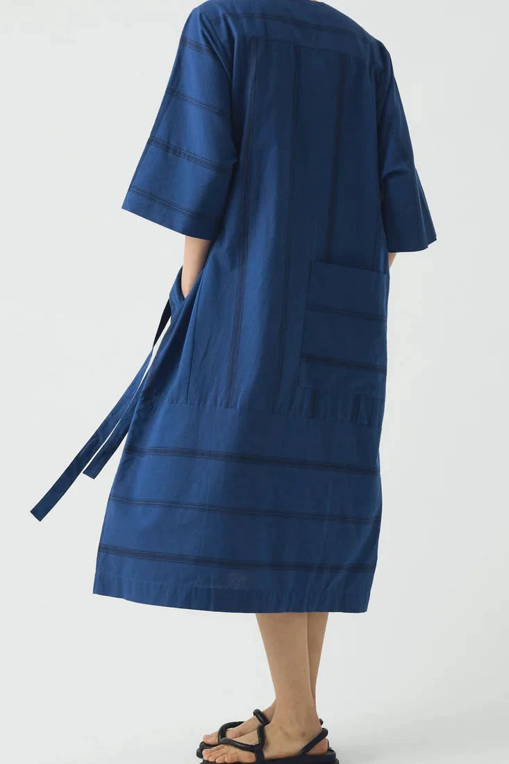 Blue dress with a belt on a white background