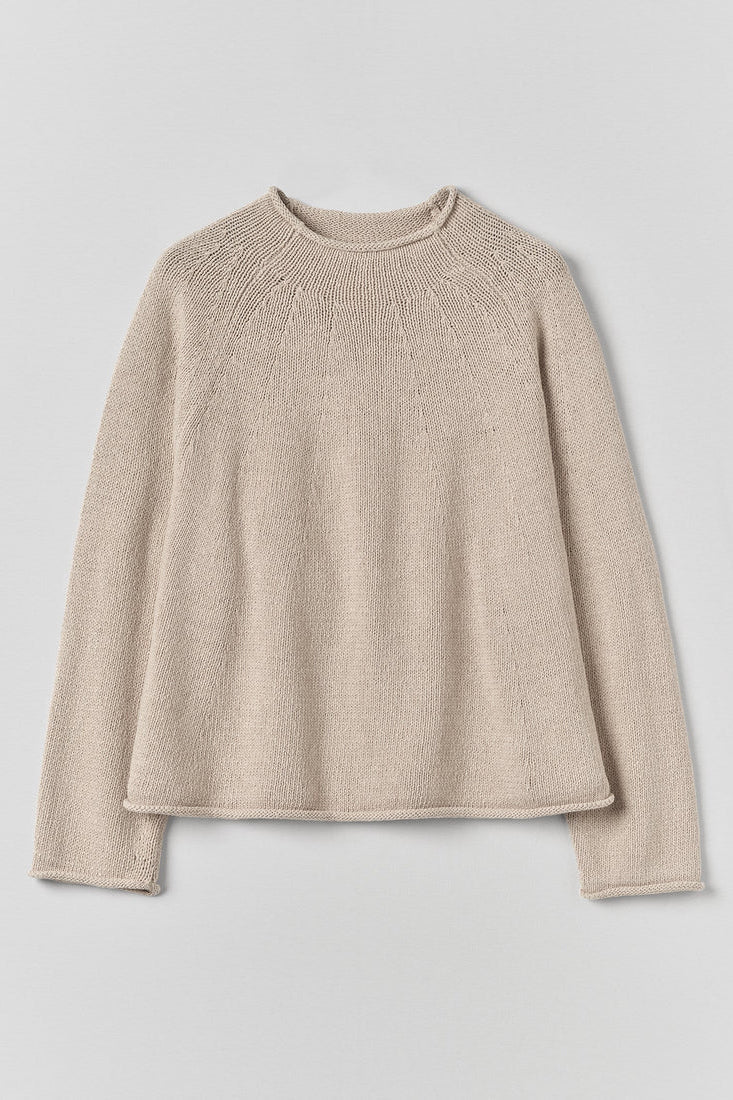 Beige sweater on a light gray background