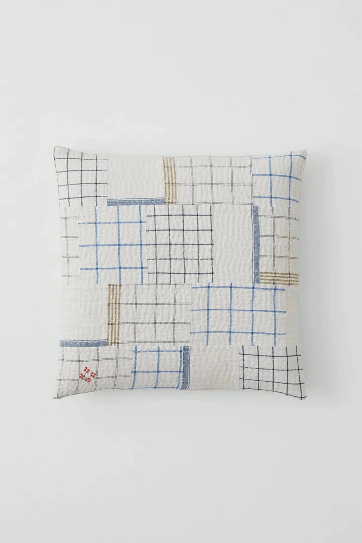 Decorative pillow with geometric pattern on a white background
