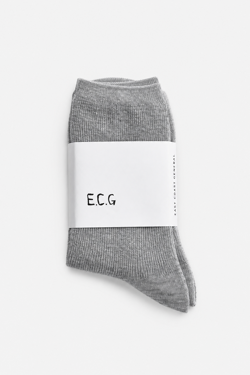 Gray sock with a white label on a light gray background