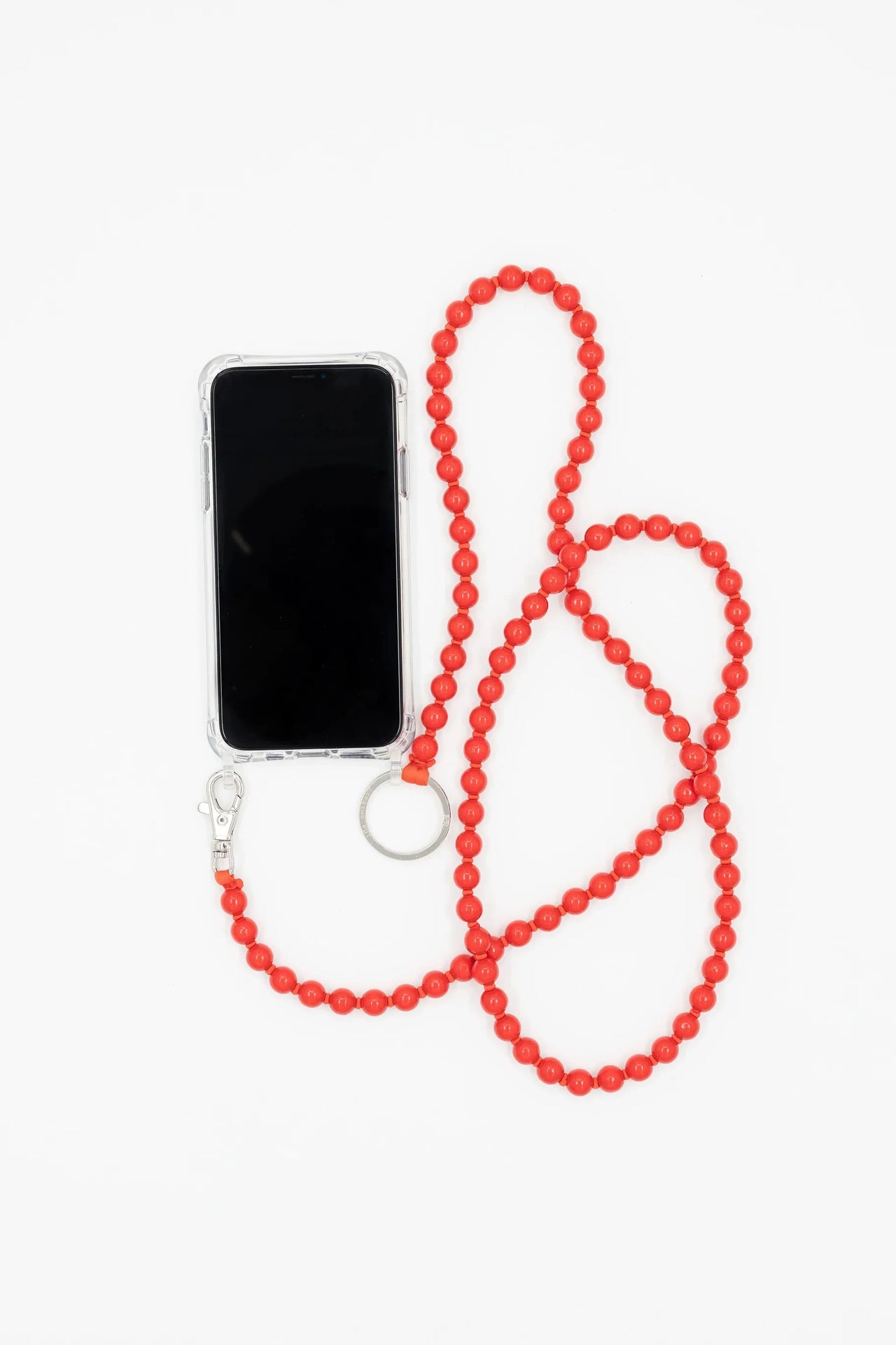 Phone case with a red beaded necklace on a white background