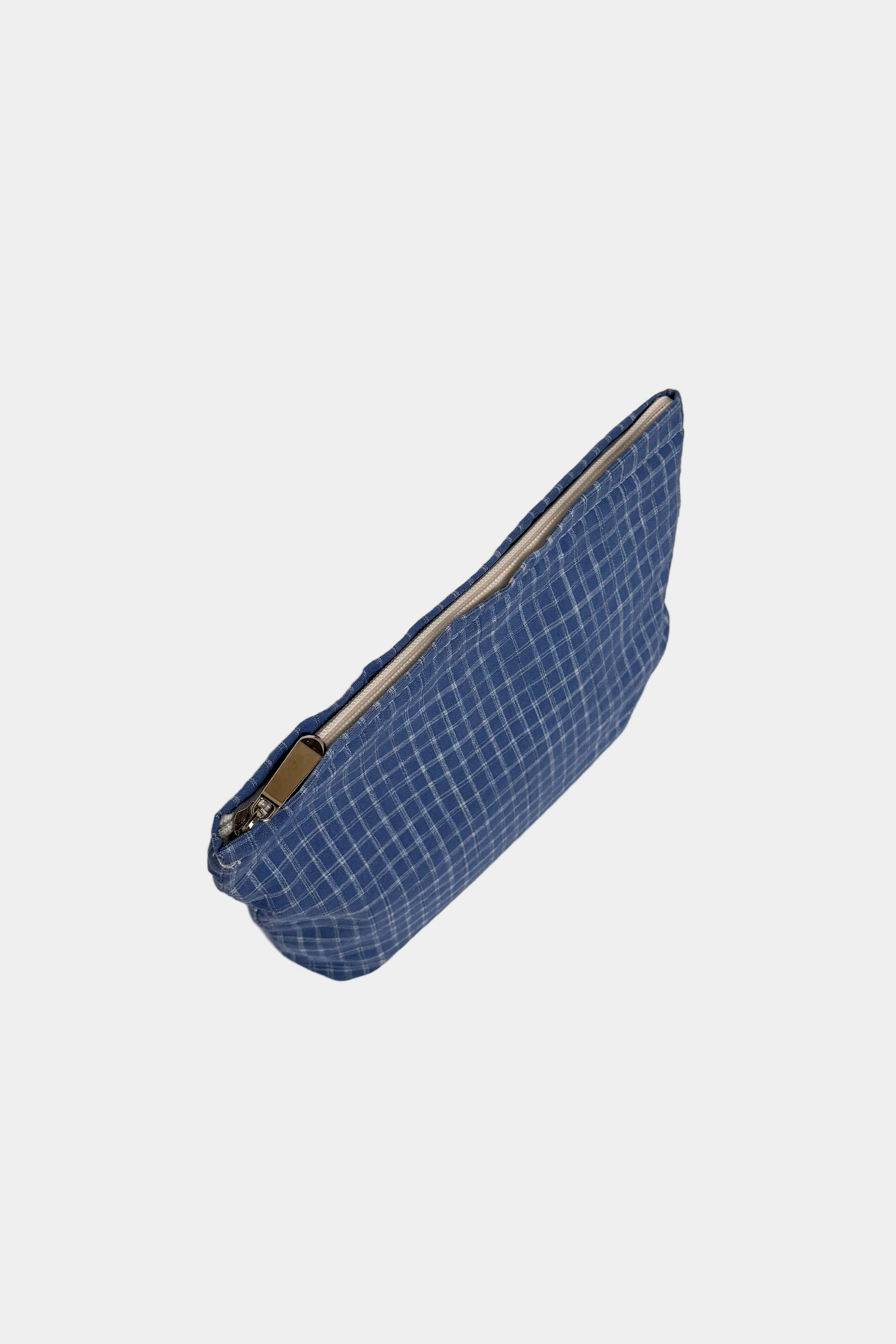 Blue checkered pouch with a zipper on a white background