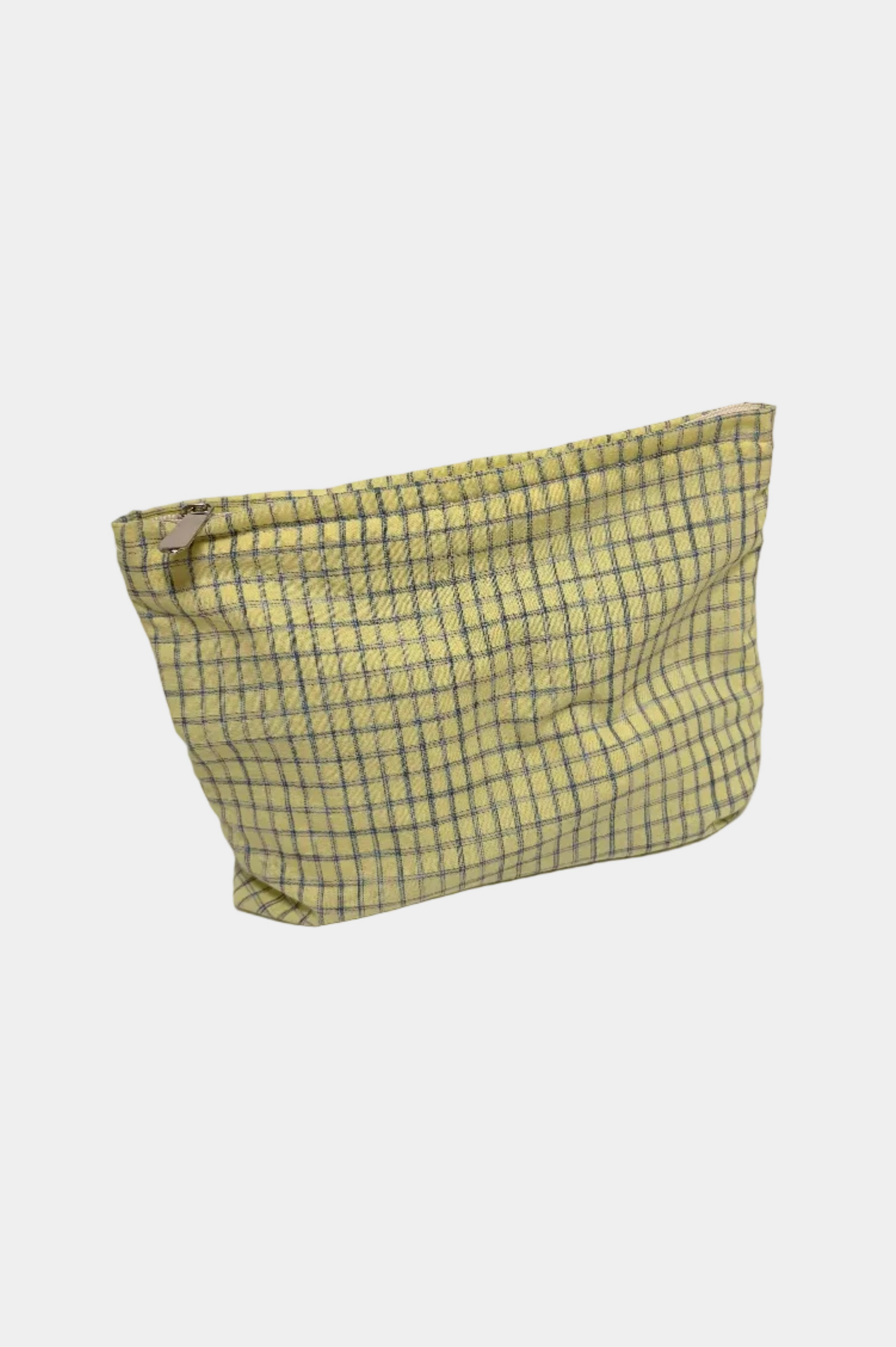 Yellow checkered pouch on a white surface 