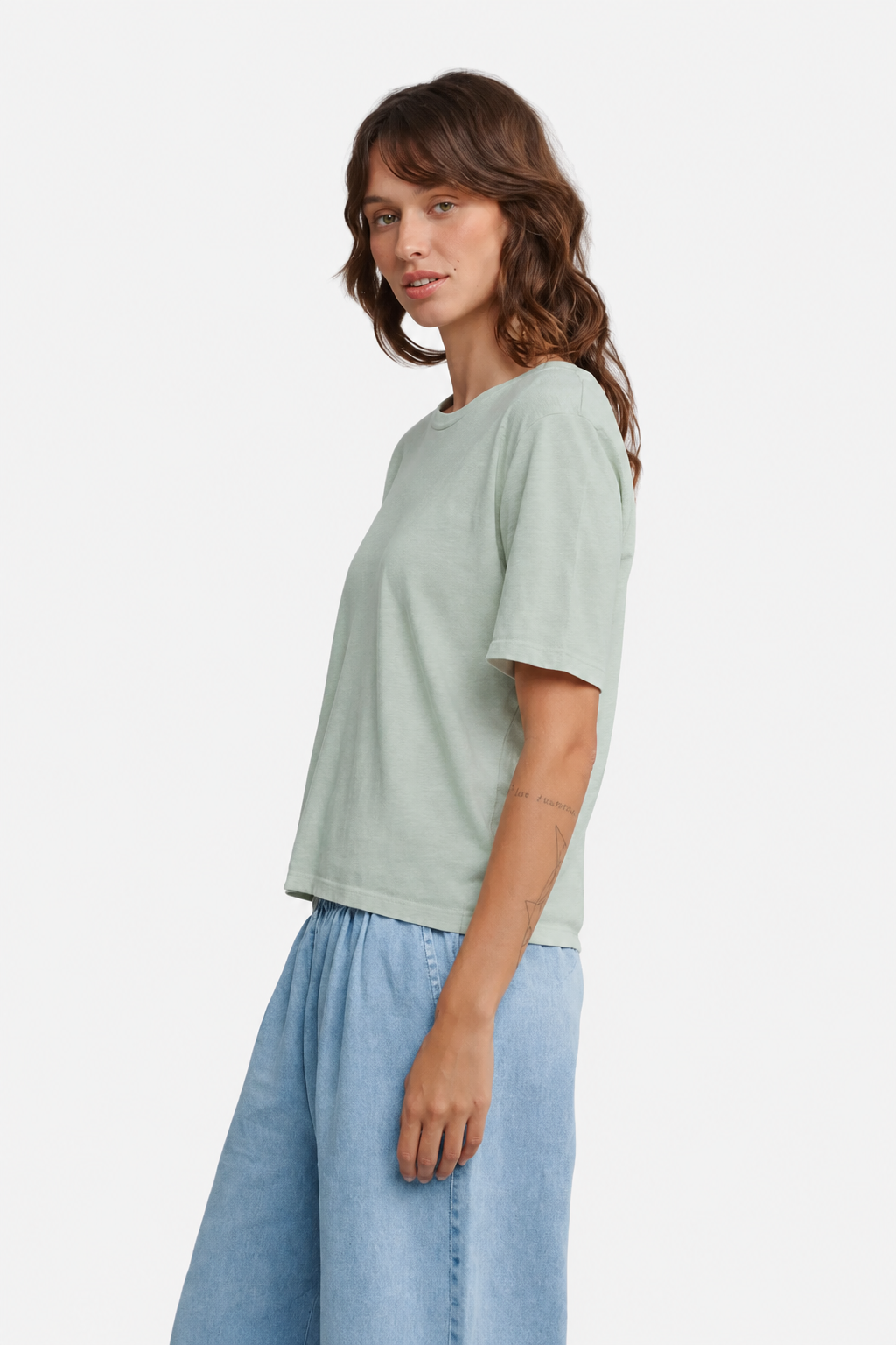 Person wearing the Jungmaven Silverlake Tee in Stormy Green side view - East Coast General