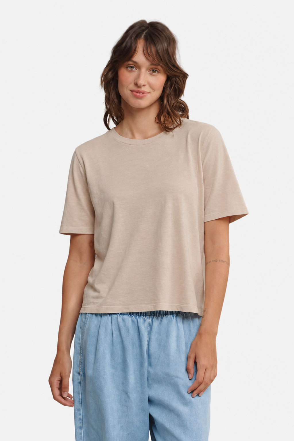 Model wearing Jungmaven Silverlake tee in Stucco Beige with denim pants - East Coast General
