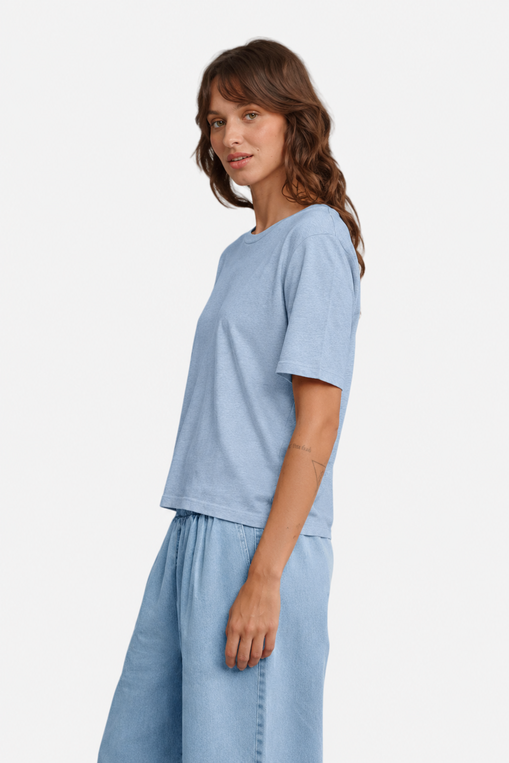 A person wearing Jungmaven silverlake tee in Rain Washed, viewed from the side - East Coast General