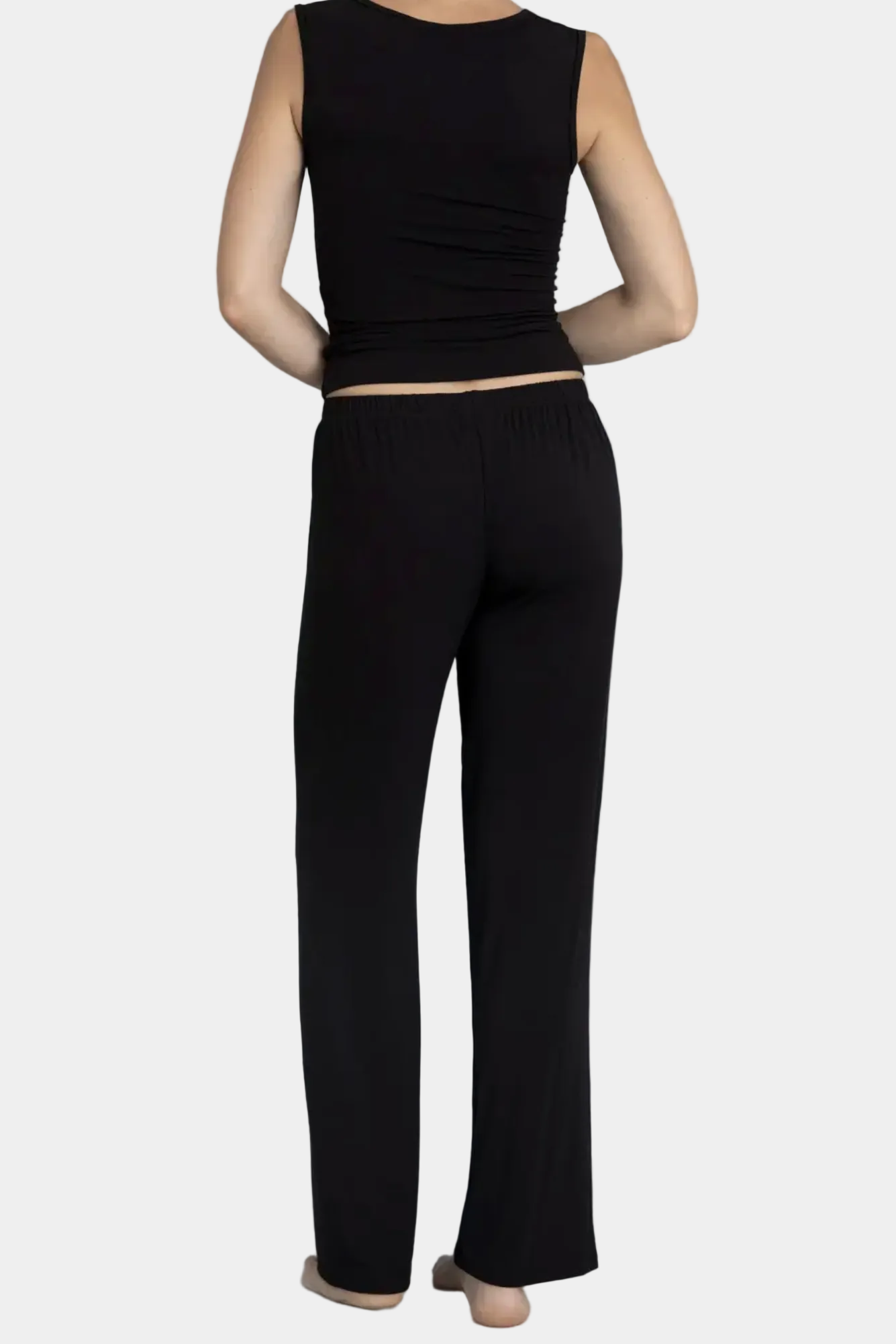 Rear view showing mid-rise waist and fluid drape on KYE Intimates Black Recline Pant