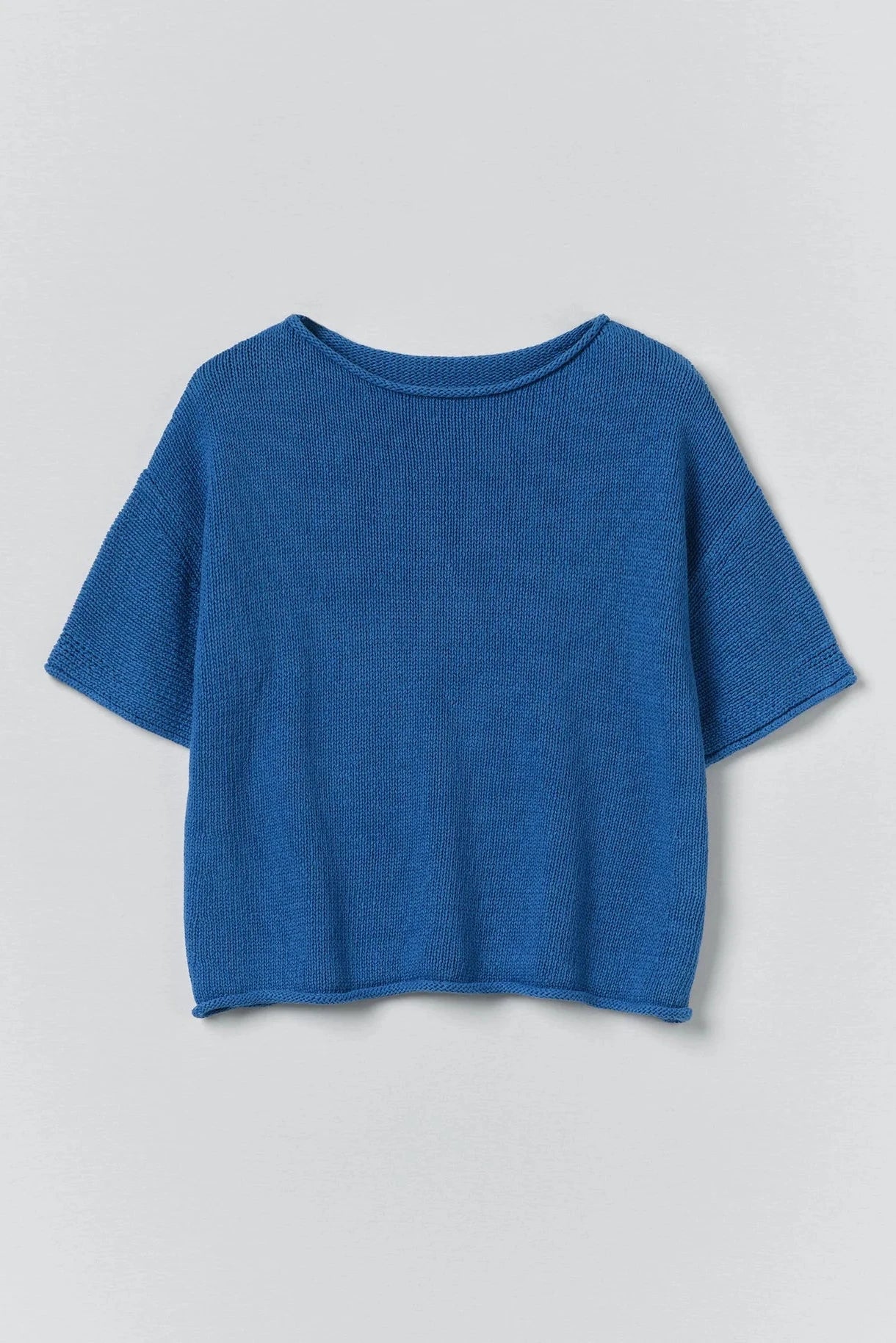Blue sweater on a light gray background