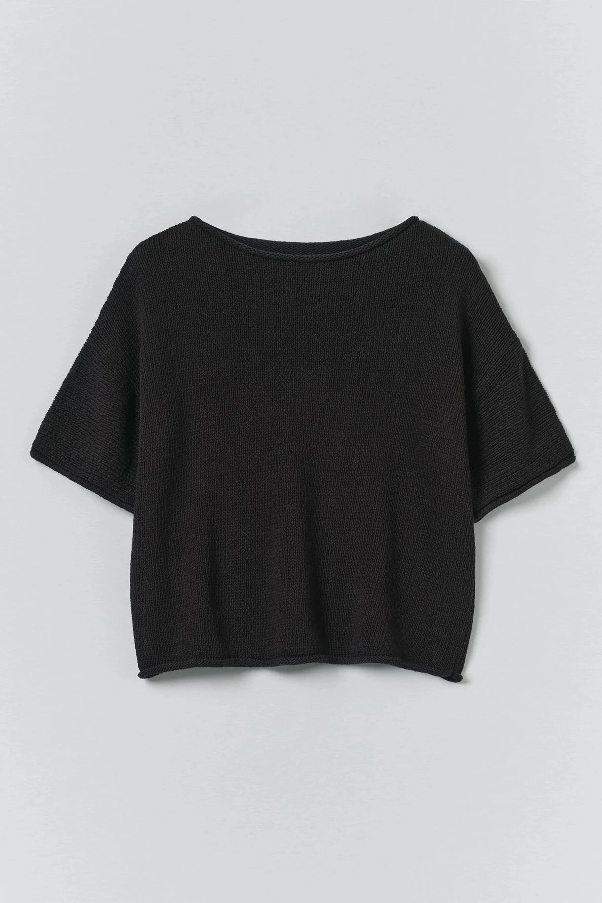 Black t-shirt on a light gray background