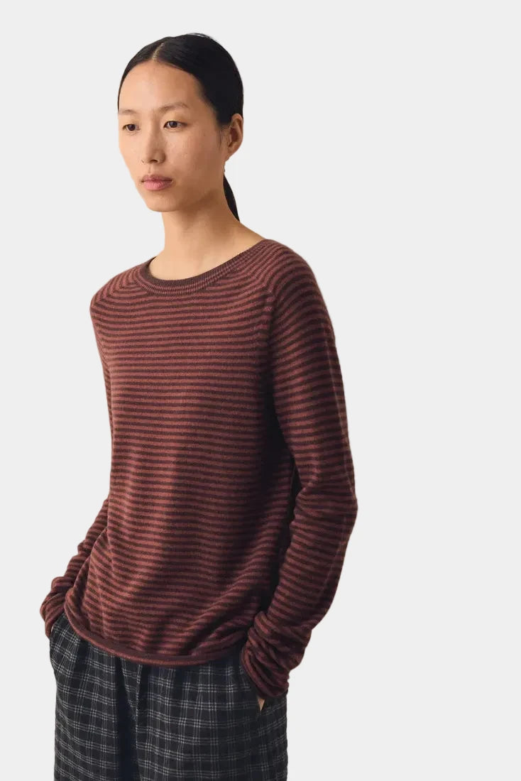 Front view of TOAST Burgundy Stripe Wool Cashmere Sweater styled with dark plaid wide-leg trousers