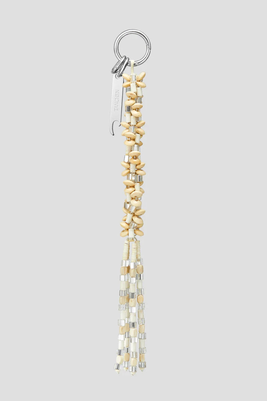 Beaded keychain with gold and silver beads on a gray background