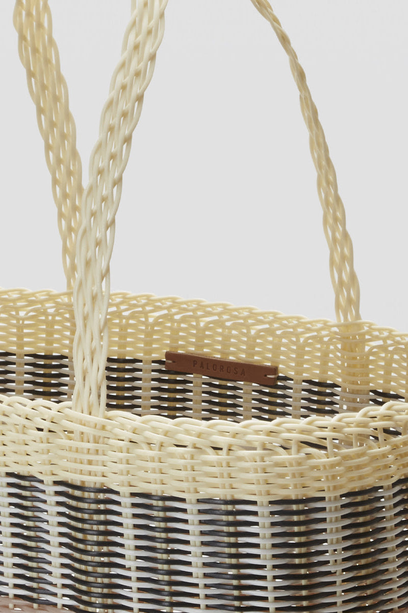 Interior view of Palorosa Mercado Medium bag showing woven handles and leather logo tag