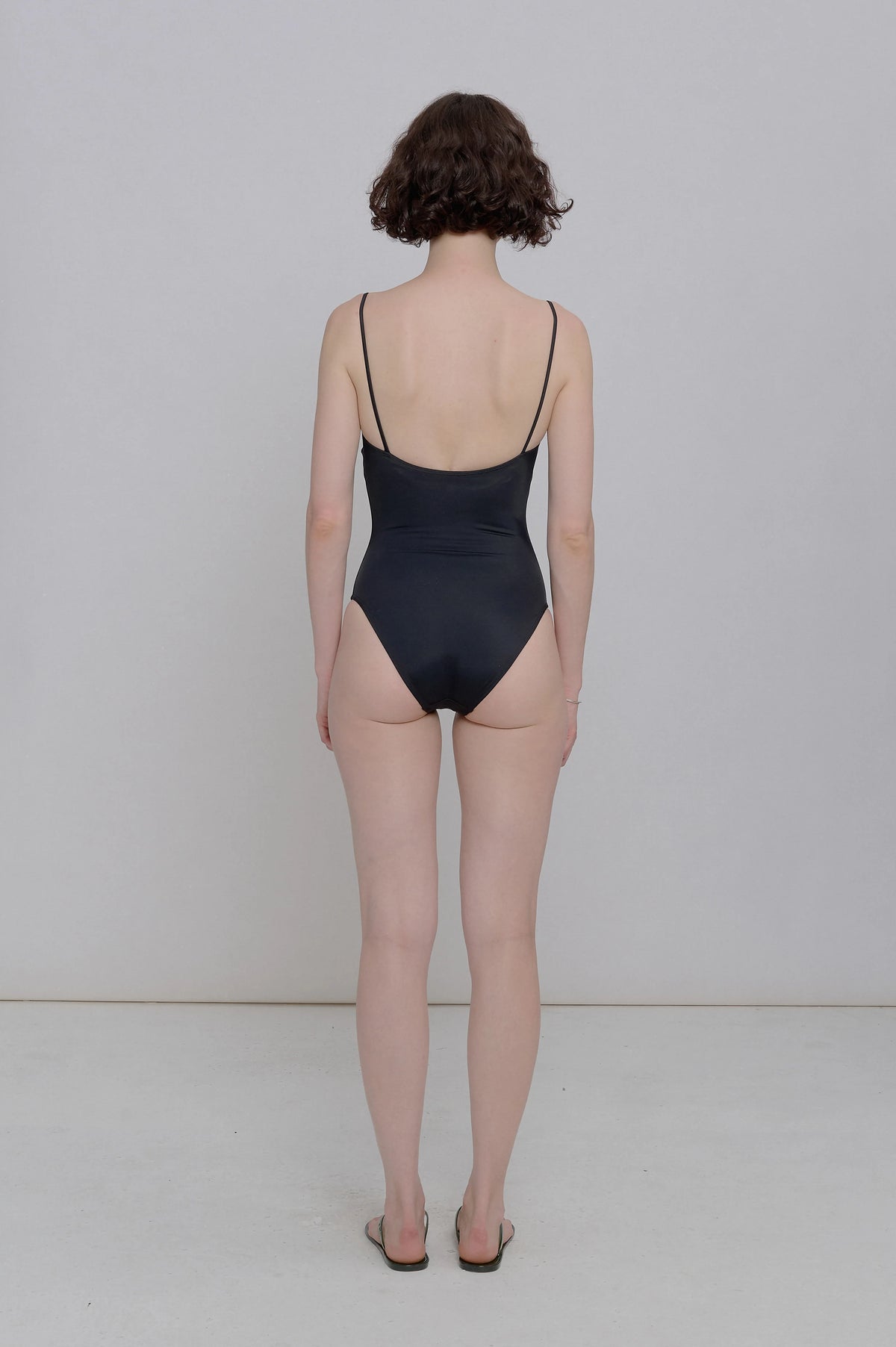 Rear view of model wearing Nu Swim Straight One Piece with wide-set shoulder straps - East Coast General